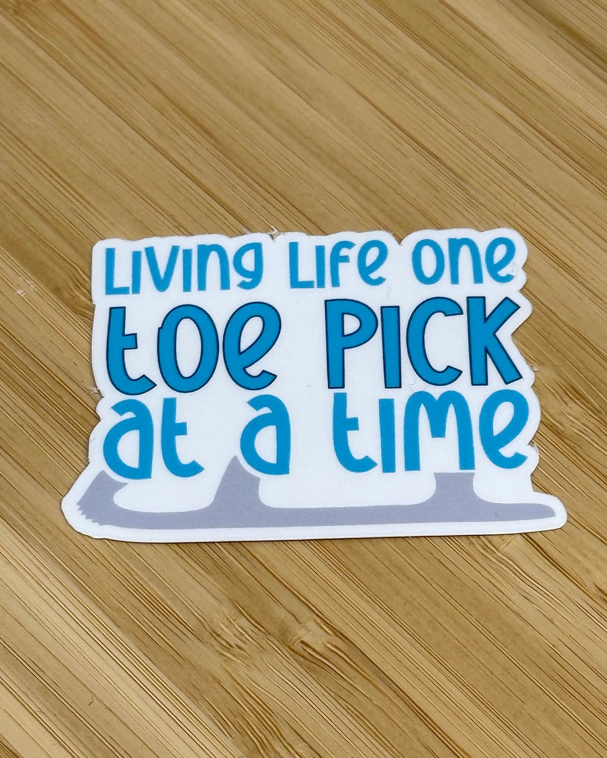 Living Life One Toe Pick At A Time Waterproof Sticker